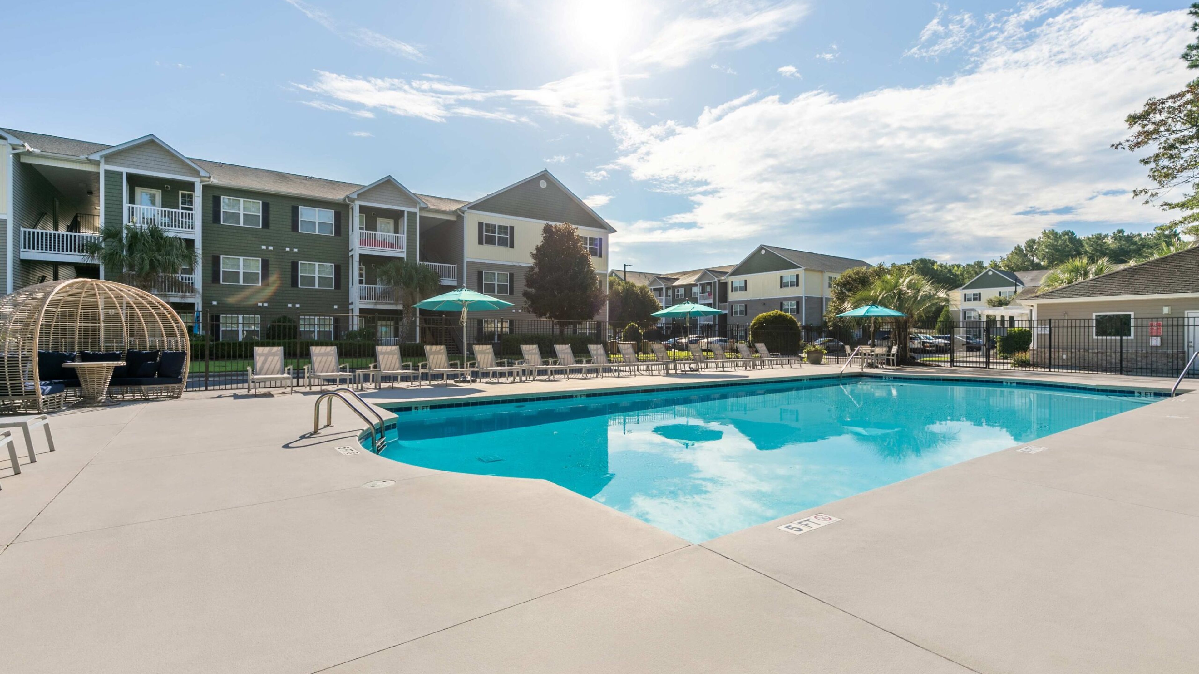 Hawthorne at Murrayville luxury outdoor pool with lounge chairs and surrounding seating